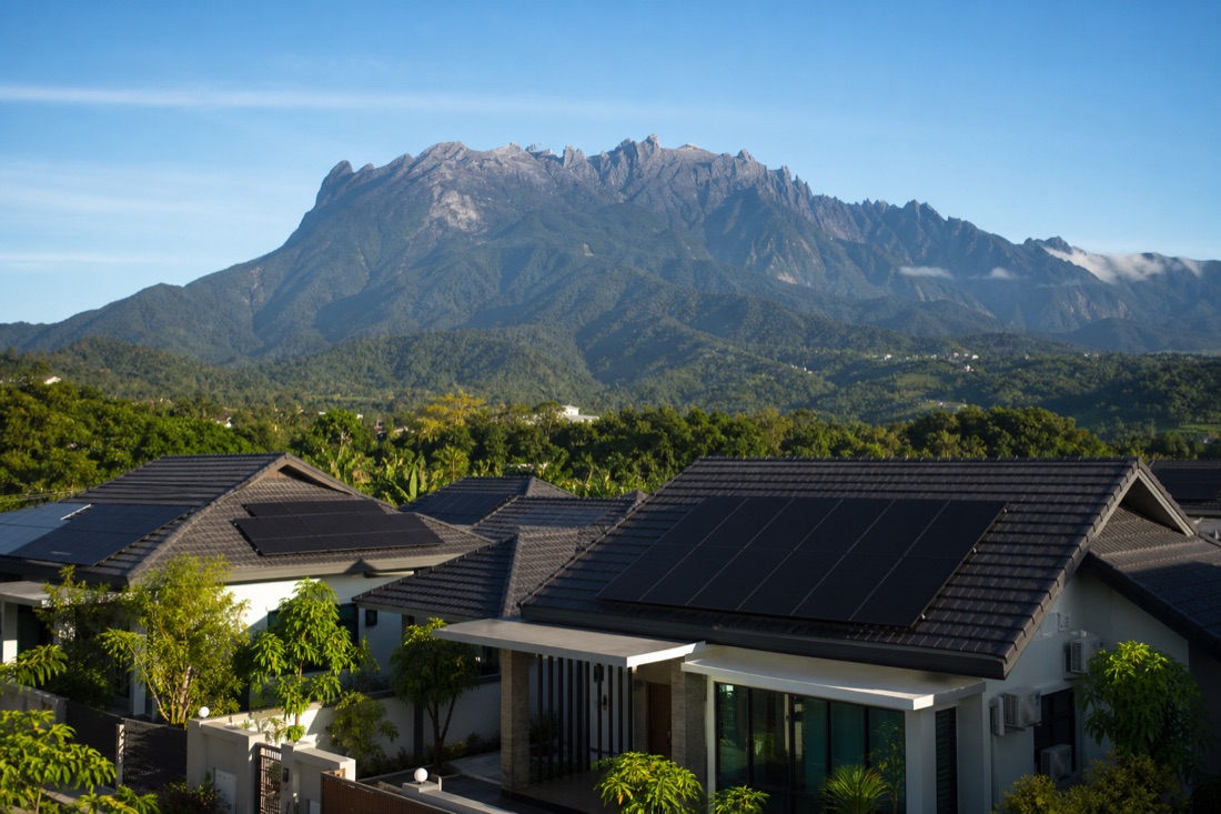 Solar-panelled home in Sabah with Mount Kinabalu in the distance